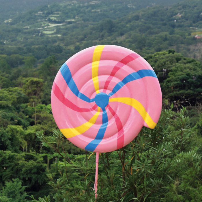 Large Swirl Lollipop Statue fiberglass in pink with blue and yellow spiral stripes