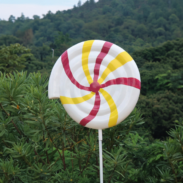Large Swirl Lollipop Statue fiberglass in white with red and yellow swirl design
