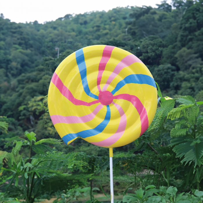 Large Swirl Lollipop Statue fiberglass in yellow with pink and blue spiral pattern