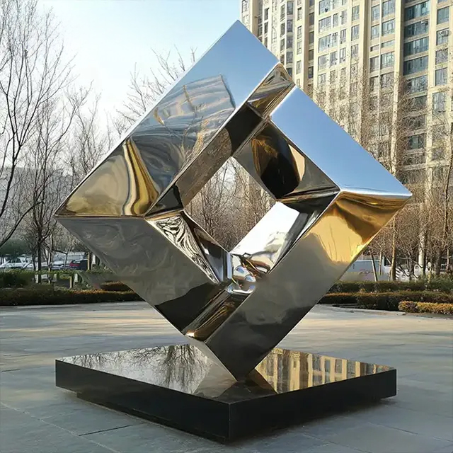 Large stainless steel abstract cube sculpture with geometric hollow core