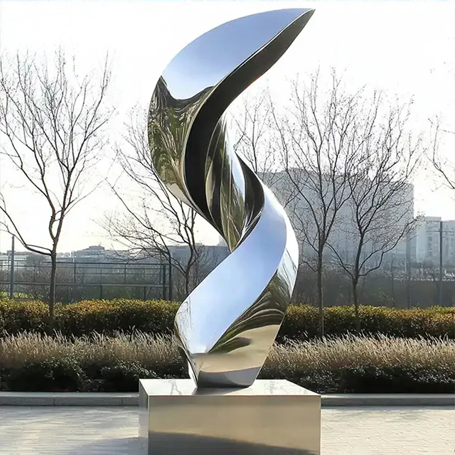Large stainless steel spiral statue featuring elegant curved form