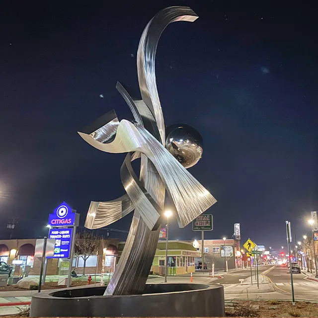 Metal Garden Art for Sale illuminated at night