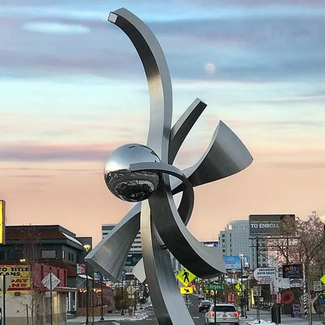Metal Garden Art for Sale with a stainless steel structure and central mirrored sphere