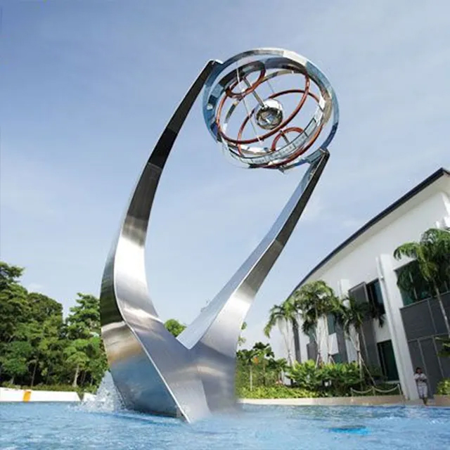 Metal Water Fountain Sculpture made of stainless steel with curved design and spherical element at the top