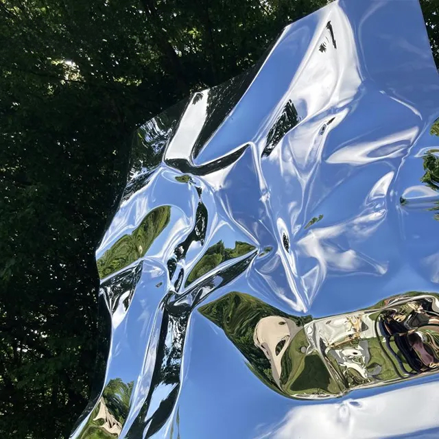 Mirror Art Sculpture with distorted reflections on stainless steel