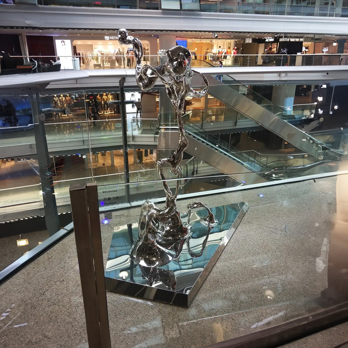 Modern Abstract Statue in polished stainless steel with flowing design