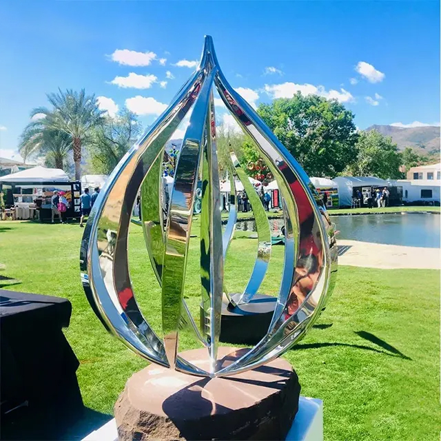 Modern Stainless Steel Abstract Statue featuring curved mirrored surfaces