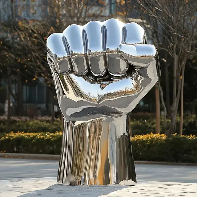 Modern stainless steel Fist Sculpture with strong muscle details