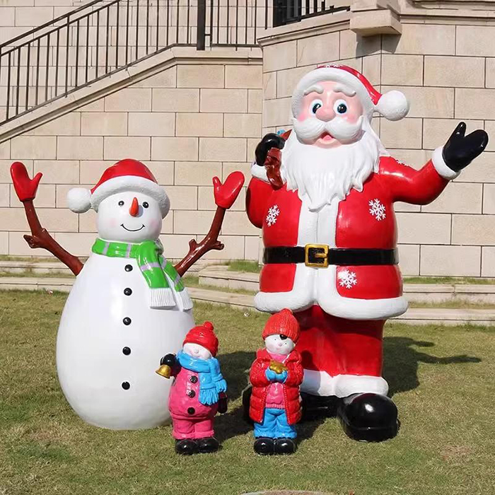 Outdoor Christmas Sculptures in fiberglass with Santa Claus, snowman, and two small festive child figurines