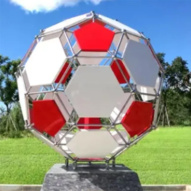 Outdoor Soccer Ball Sculpture featuring red and white stainless steel panels