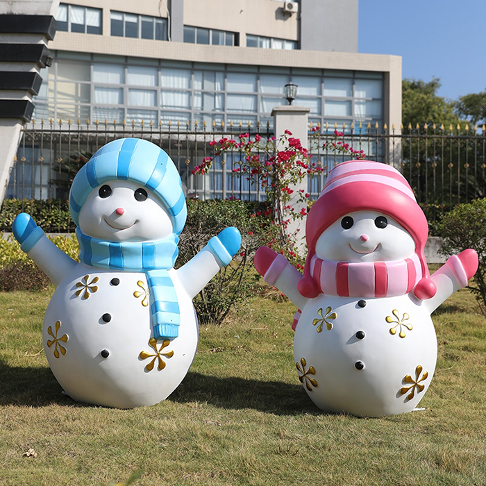 Pair of Snowman Garden Ornament fiberglass figures in blue and pink outfits