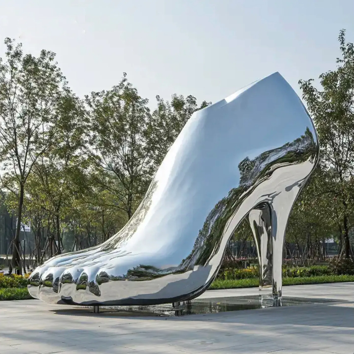 Polished stainless steel High Heel Shoe Sculpture with realistic human toes