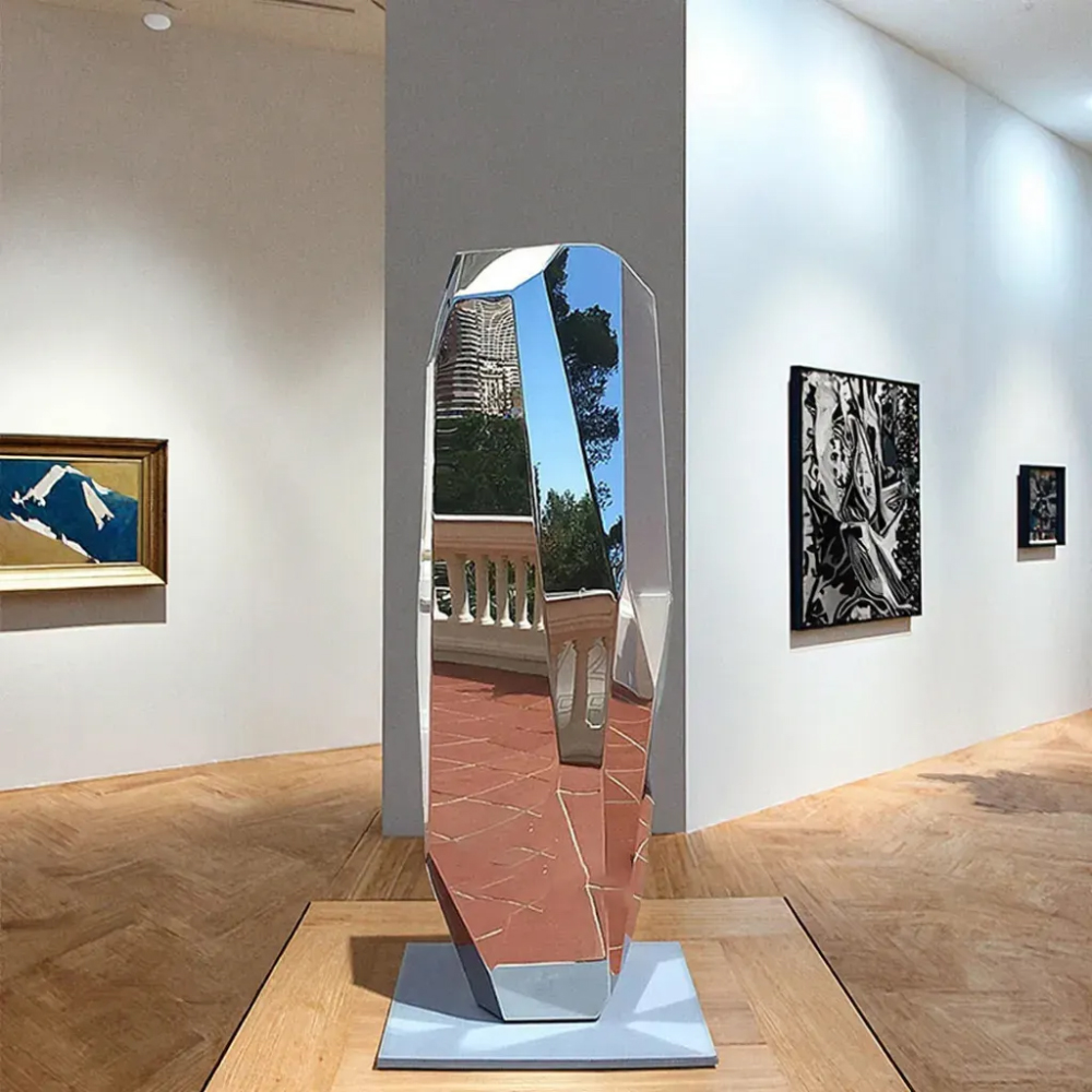 Polished stainless steel Modern Geometric Sculpture with crystal-like faceted surfaces