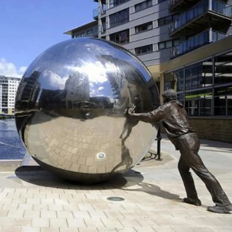 Man Pushing Sphere Statue
