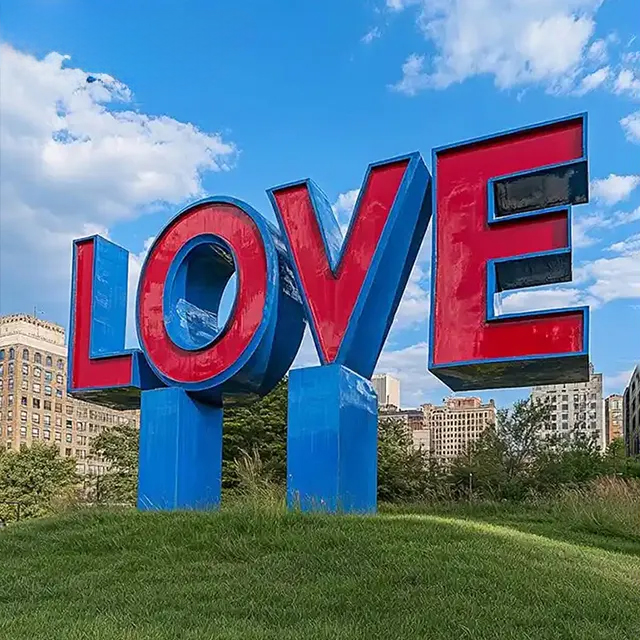 Red and blue stainless steel Love Letter Sculpture with bold sans-serif design
