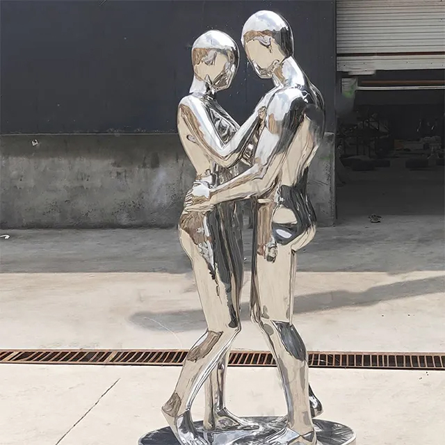 Silver Couple Sculpture made of stainless steel showing two lovers embracing