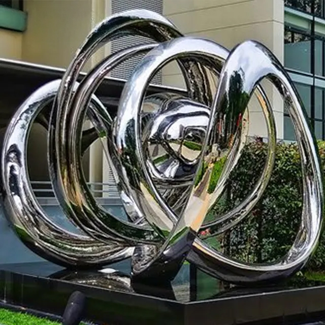 Stainless Steel Abstract Sculpture featuring twisted metal loops inspired by string theory