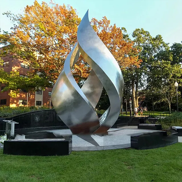 Stainless Steel Flame Garden Sculpture on an open lawn