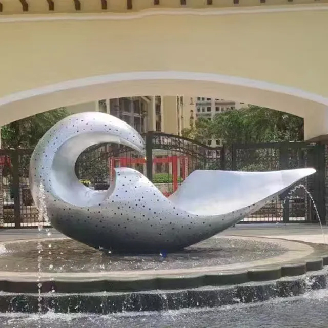 Stainless steel Abstract Wave Sculpture with smooth curves and perforated texture