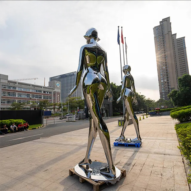 Stainless steel Life Size Robot Statue featuring a futuristic female robot with elegant postures