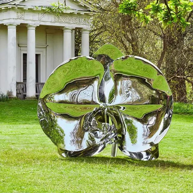 Stainless steel Metal Orchid Sculpture featuring large reflective petals