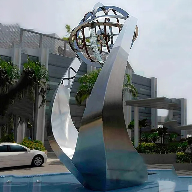 Stainless steel Metal Water Fountain Sculpture resembling yacht hull and globe structure