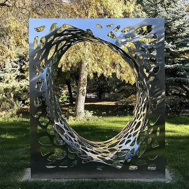 Stainless steel abstract cube sculpture with rectangular frame and organic hollow circular center