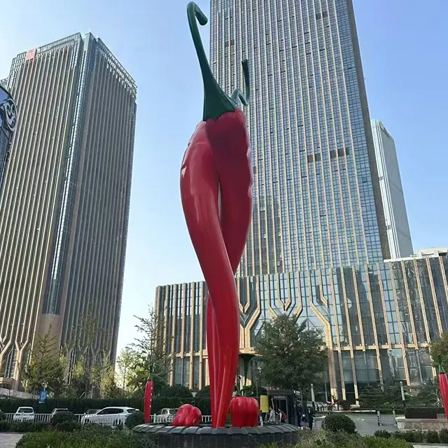 Tall red Chili Pepper Sculpture made of stainless steel with green stem