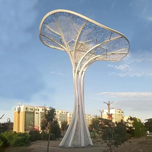 Tall stainless steel Contemporary Tree Sculpture with flowing trunk lines and wide canopy