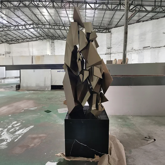 Tall stainless steel Geometric Art Sculpture with layered polygonal shapes