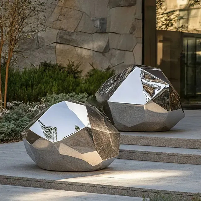 Two stainless steel Metal Rock Sculptures