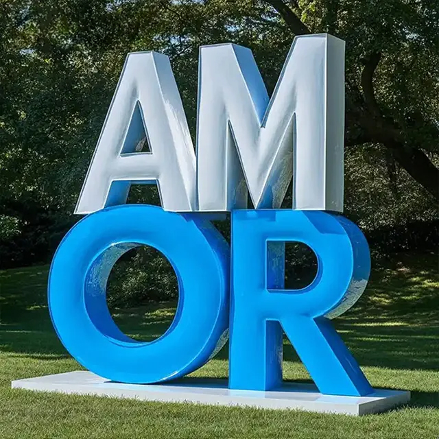 White and blue stainless steel Love Letter Sculpture in Spanish “AMOR” design
