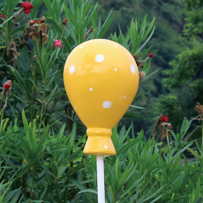 Yellow fiberglass Christmas Balloon Sculpture with polka dot design