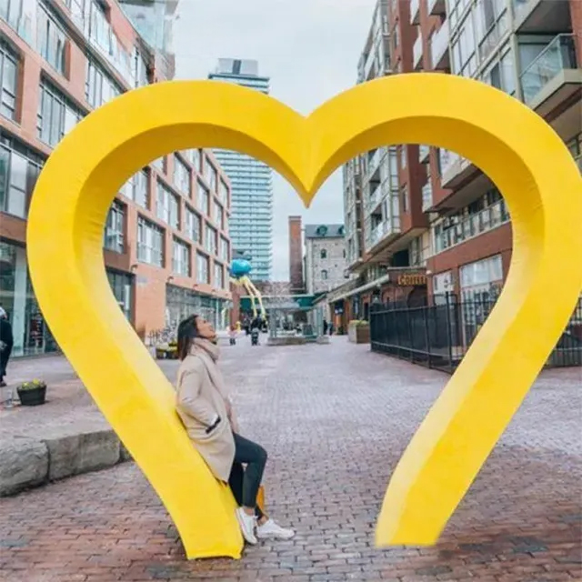 Yellow stainless steel Heart Art Sculpture with a hollow center