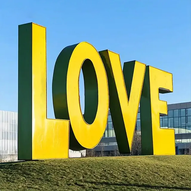 Yellow stainless steel Love Letter Sculpture with tall block letters