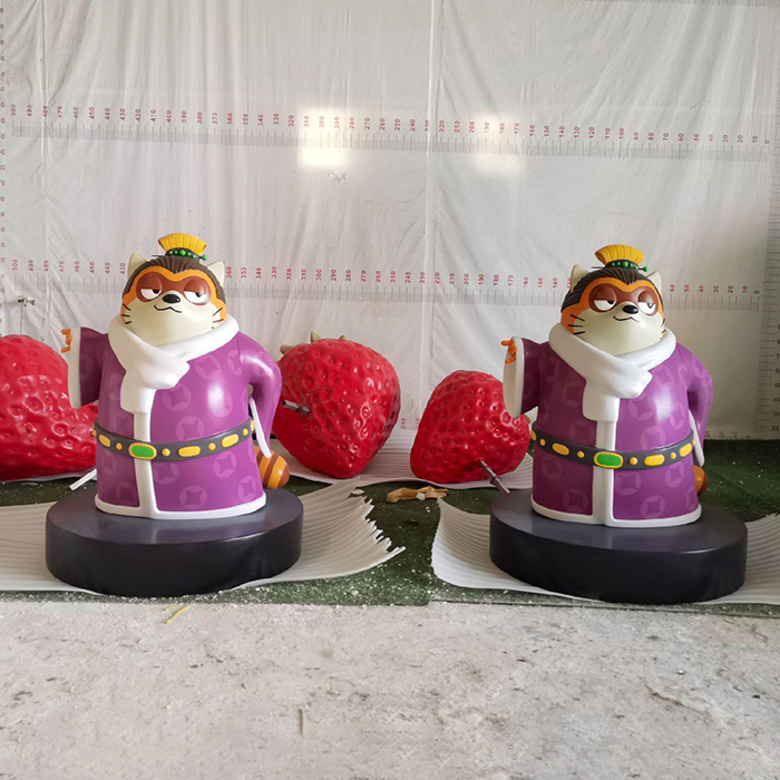 a pair of Fiberglass Racoon Lawn Ornament in purple robe with scarf