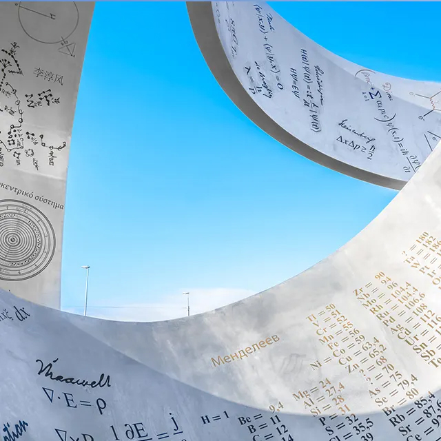 close-up view of stainless steel Knowledge Sculpture with engraved scientific formulas and equations
