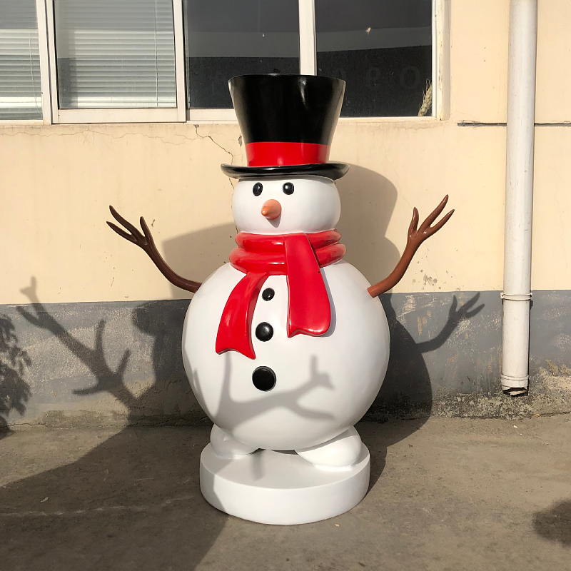 fiberglass Giant Outdoor Snowman Statue depicts a snowman with black top hat, red scarf, branch arms