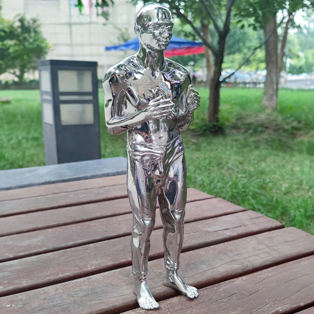 mirror polished stainless steel man sculpture standing barefoot