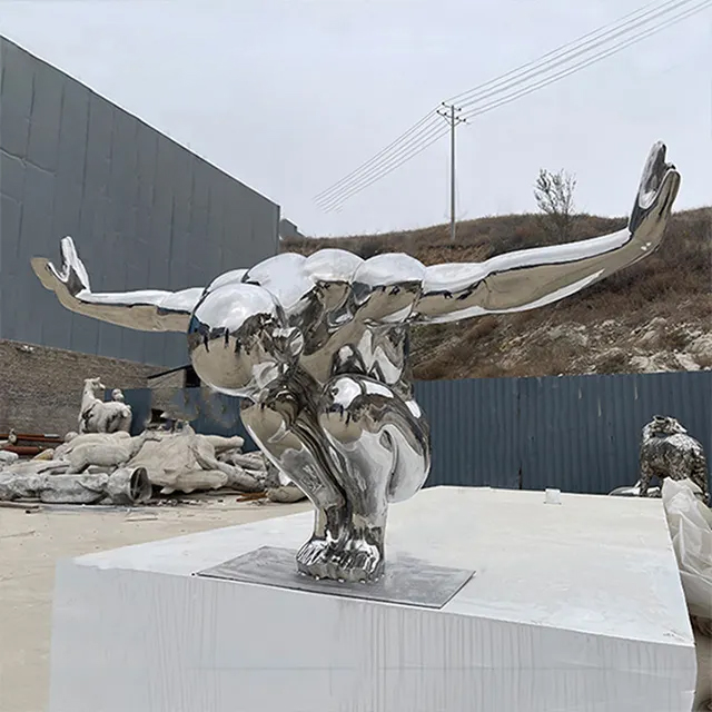 polished stainless steel Diver Sculpture preparing for a dive