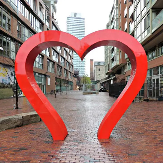 red stainless steel Heart Art Sculpture featuring a contemporary open-frame heart design