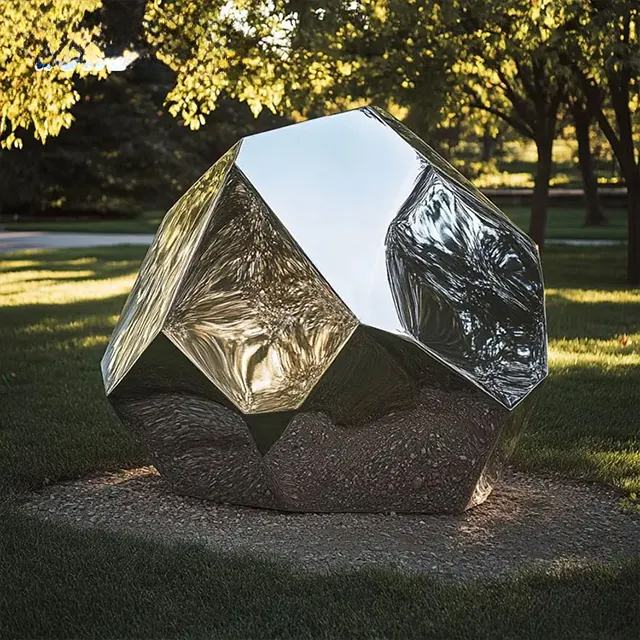 single stainless steel Metal Rock Sculpture on the grass