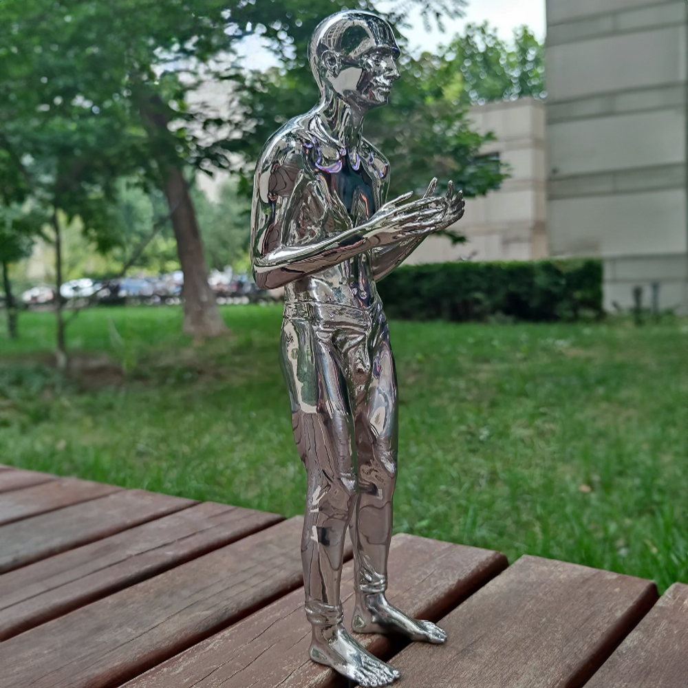 sleek stainless steel man sculpture
