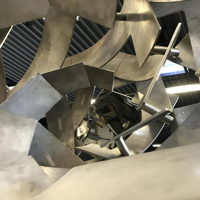 striking vortex sculpture in stainless steel with layered