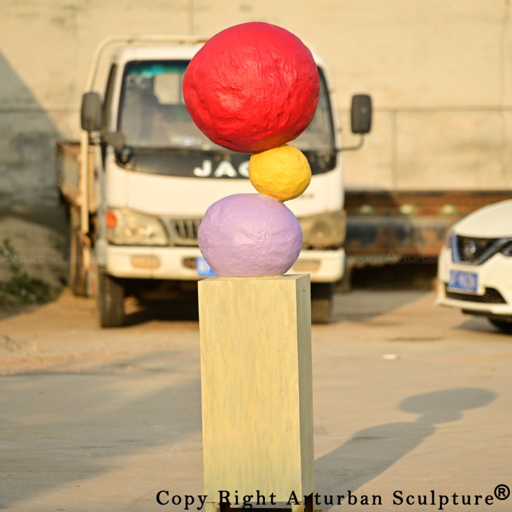 0-Annie Morris Sculpture inspired bronze artwork with stacked red, yellow, and purple spheres