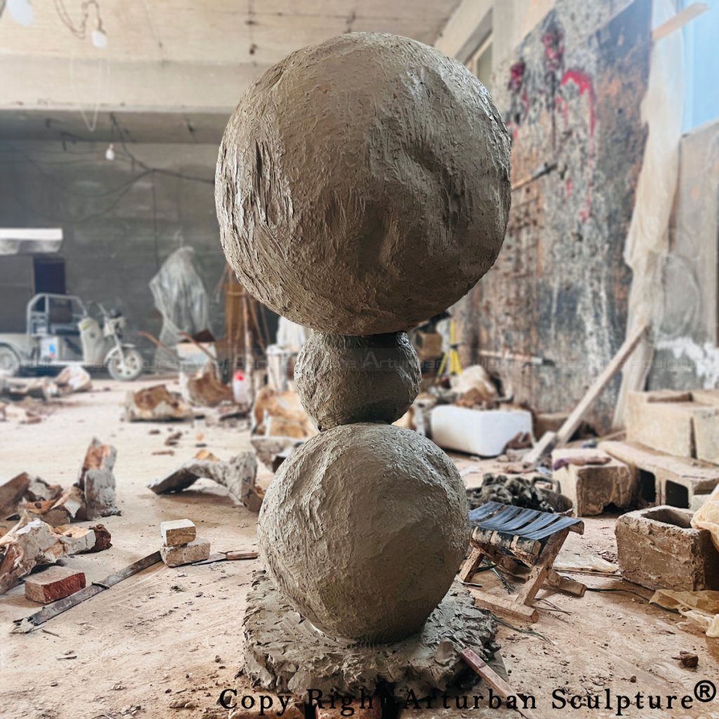 7-Clay version of Annie Morris stack Sculpture with three spheres stacked vertically