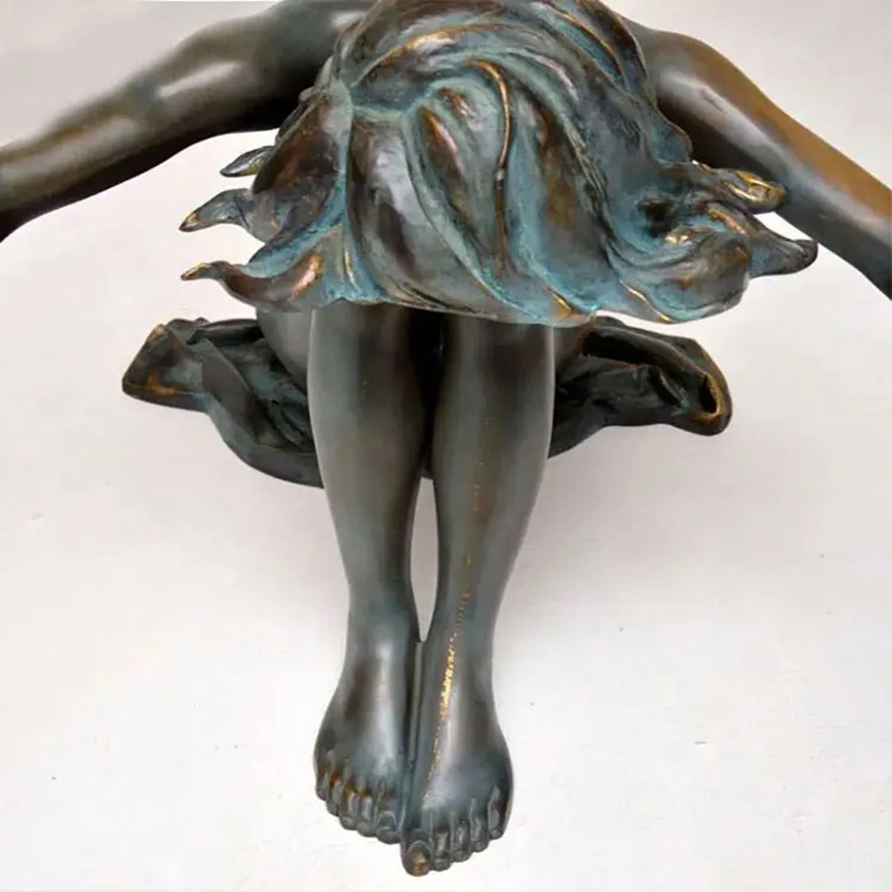 Close-up of bronze Woman Statue Coffee Table showing detailed legs and skirt design