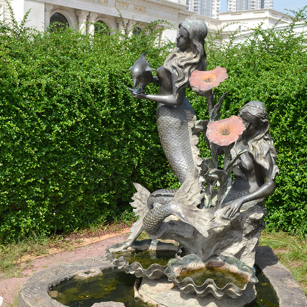 Decorative bronze mermaid fountains with twin mermaids and floral details