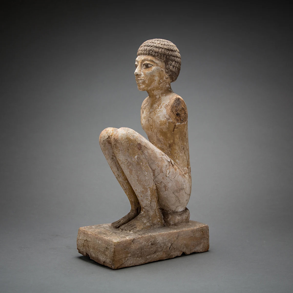 Egyptian figure sculpture showing detailed facial features