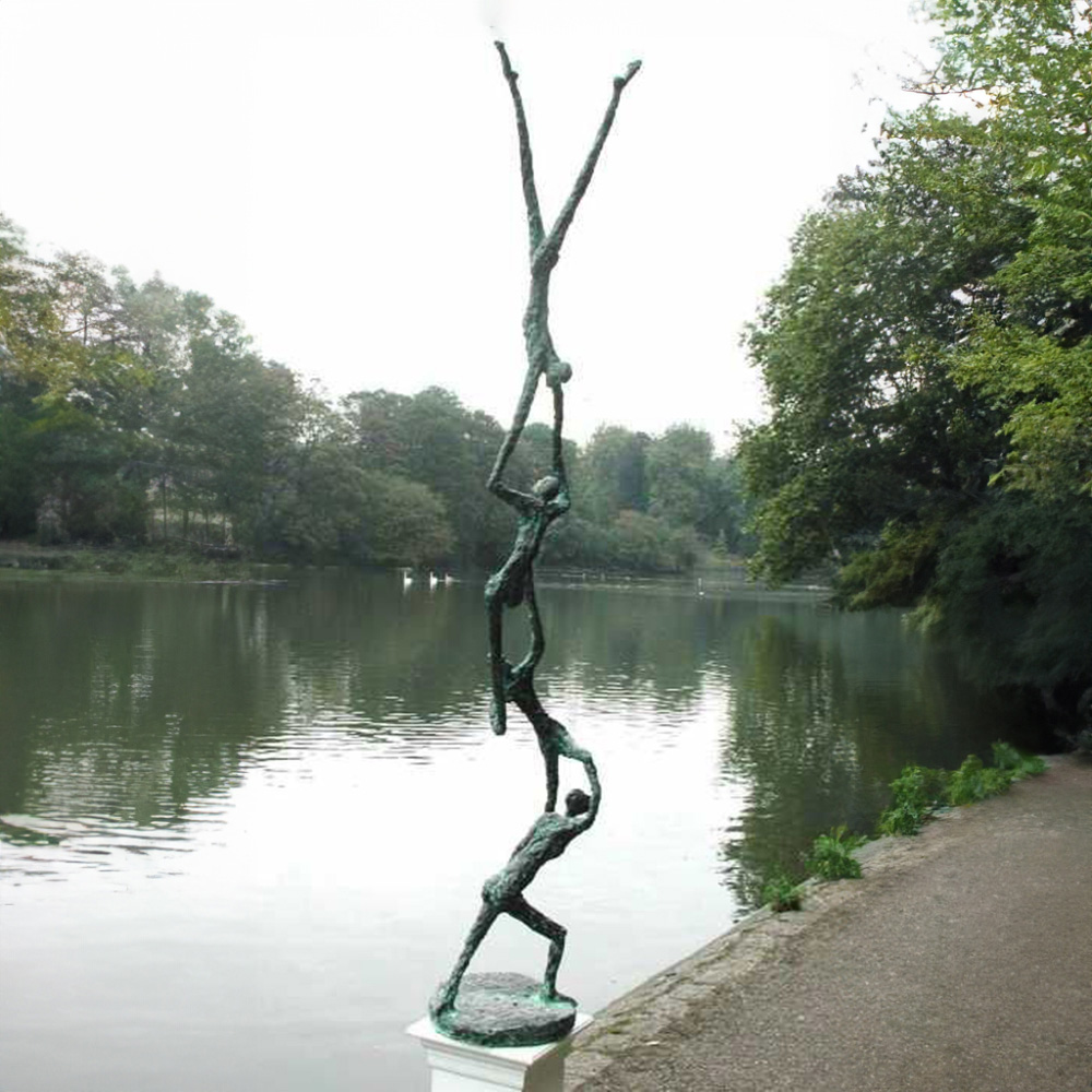 Michael Speller Sculpture bronze showing four elongated human figures stacked vertically with the top figure in a handstand, symbolizing family support and unity.